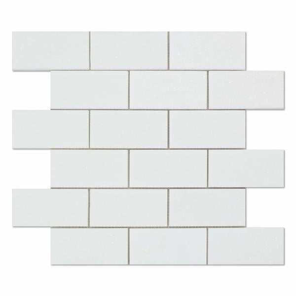Close-up of polished Thassos White 2x4 marble mosaic tiles