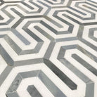 Close-up of Thassos White Berlinetta Blue showing polished blue accent and white marble