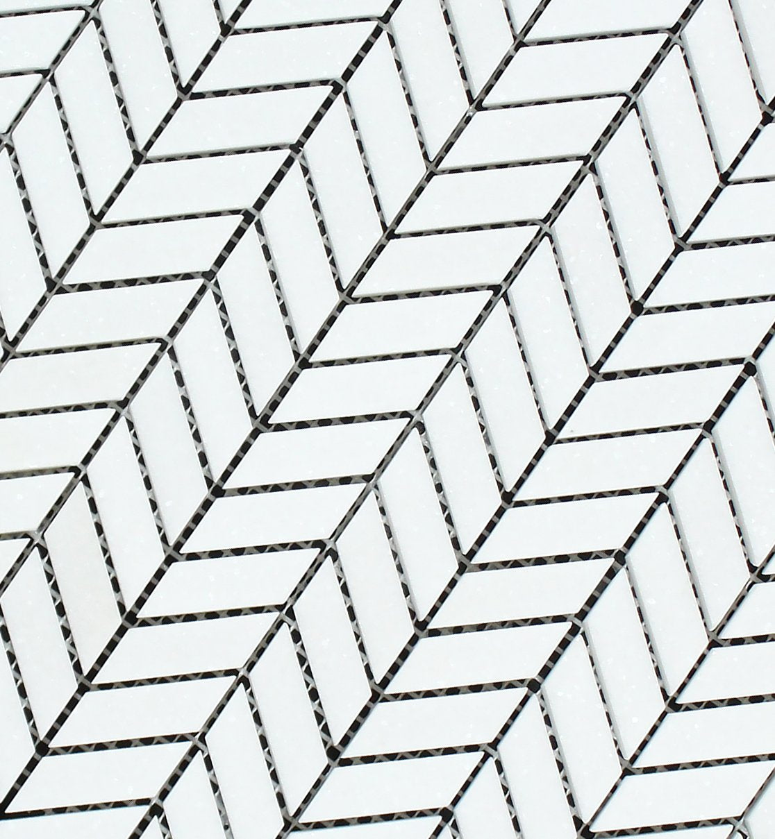 Close-up of Thassos White Mini Chevron pattern showing crisp marble angles