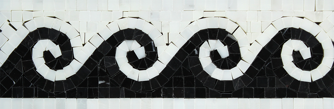 Close-up view of black wave on white marble border tile
