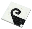 Close-up of black wave accent on Thassos White marble corner tile