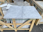 Close-up of Tundra Grey Marble showing veining and textured leathered surface