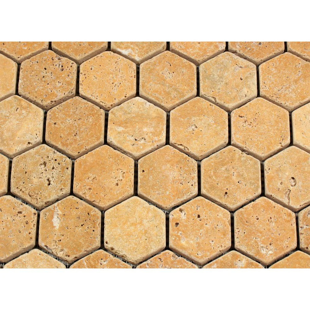 Close-up of Tuscany Gold 2x2 Hexagon Mosaic showing tumbled texture and warm stone variation