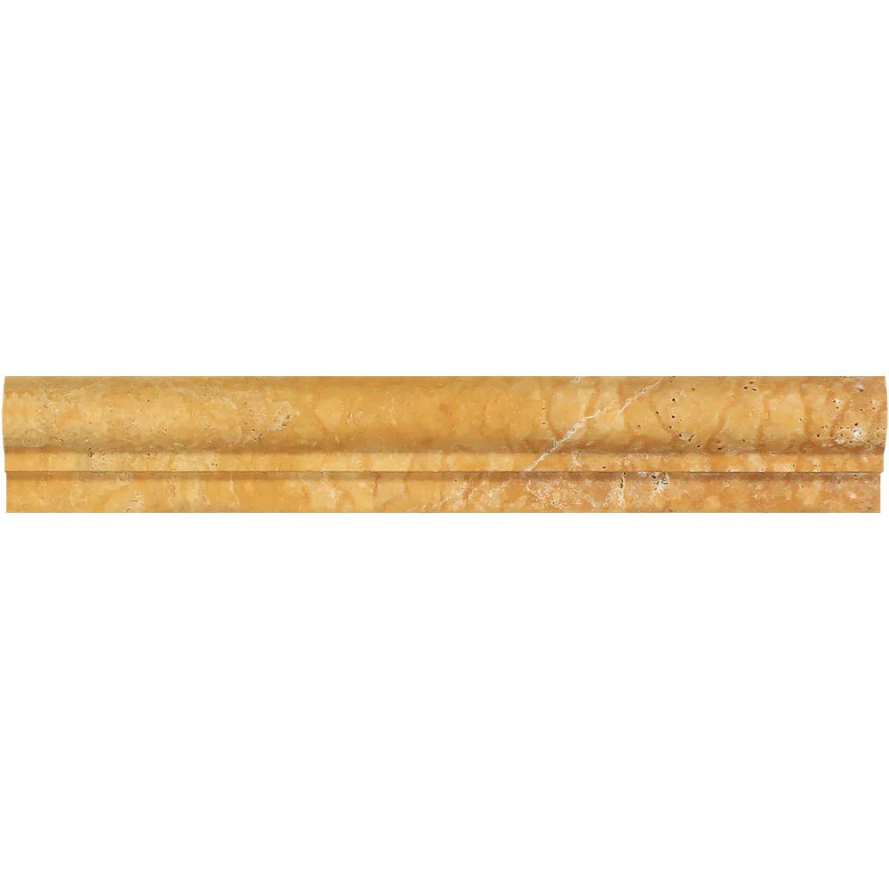 Close-up of 2x12 travertine chair rail molding showing honed finish and warm gold veining