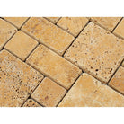 Close-up of mini-format travertine pattern with tumbled edges and natural warm tones