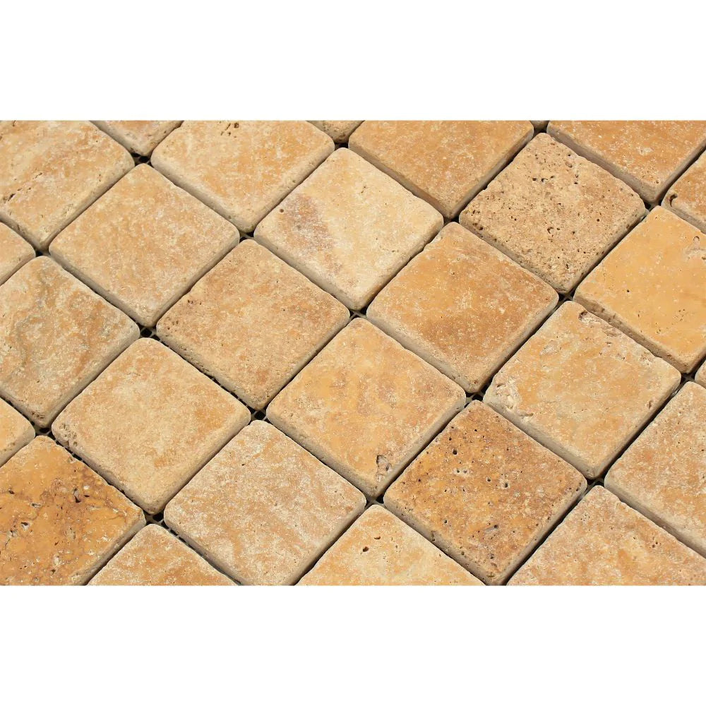 Close-up of Tuscany Gold 2x2 travertine mosaic showing natural stone variatio