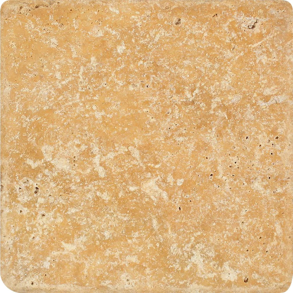 Close-up of Tuscany Gold 6x6 Travertine tile with natural veining and tumbled edge