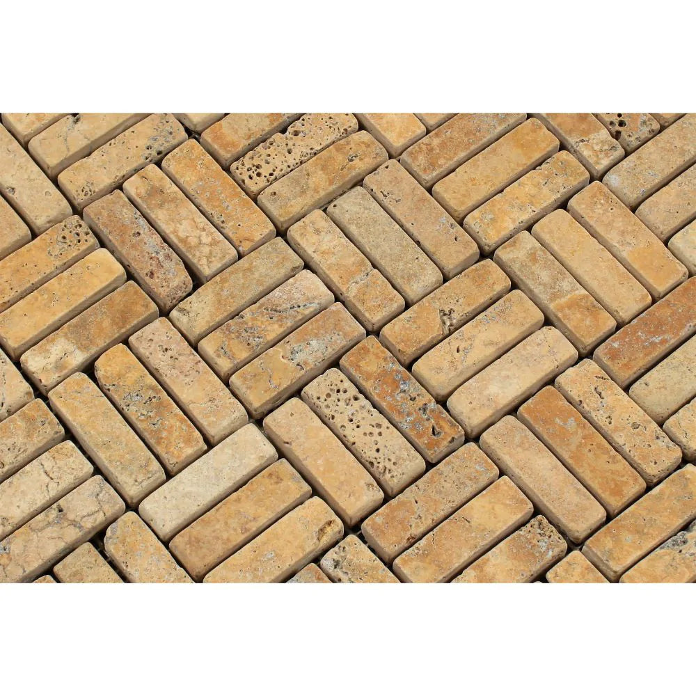 Close-up of tumbled strip travertine mosaic showing textured golden tones
