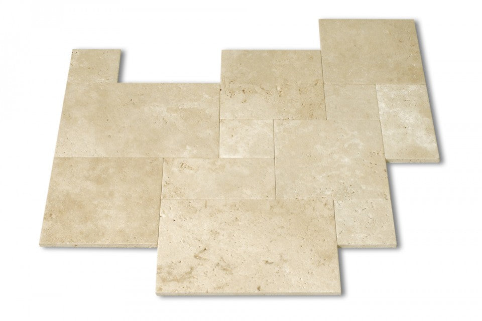 Close-up of Tuscany Ivory Travertine paver showing soft ivory tones and texture
