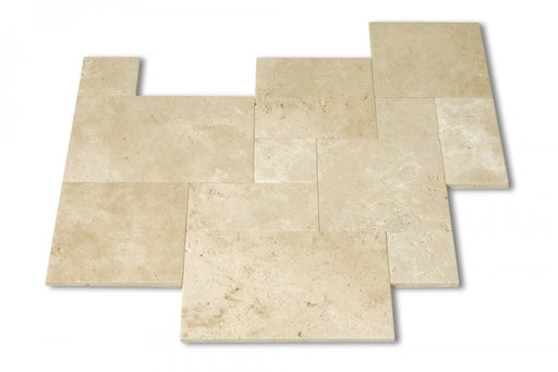 Close-up of Tuscany Ivory Travertine paver showing soft ivory tones and texture
