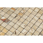 Close-up of 1x1 tumbled travertine mosaic showing rounded edges and warm natural variation