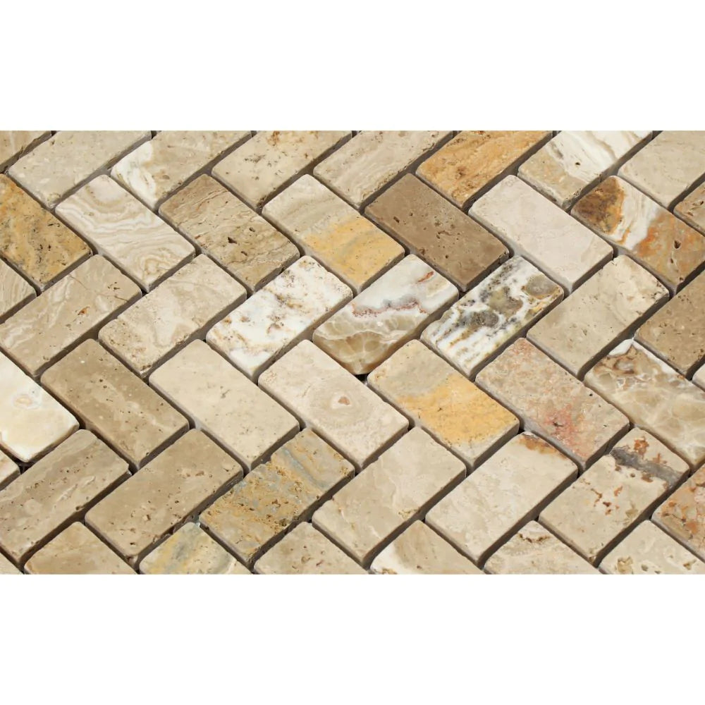 Close-up of Valencia Travertine 1x2 Herringbone pattern mosaic showing tumbled finish and earthy tones