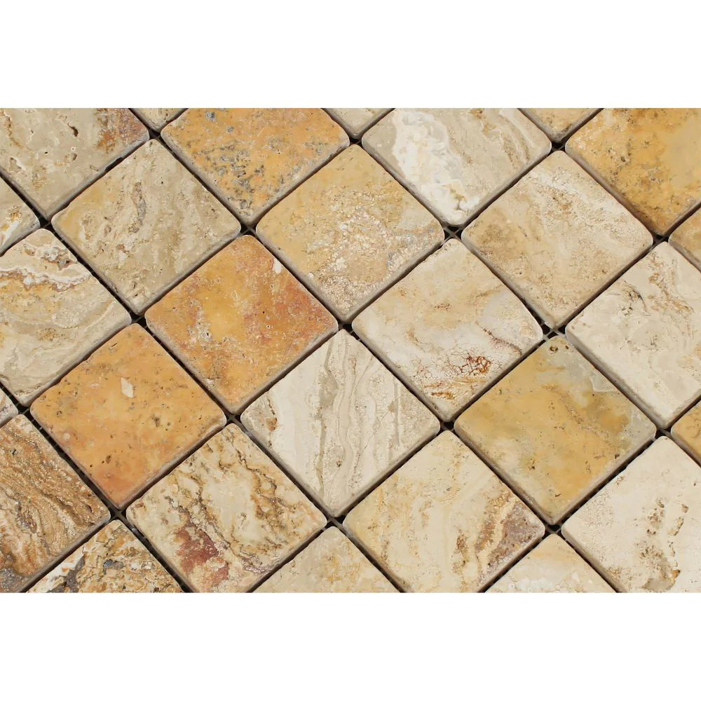 Close-up of tumbled 2x2 Valencia Travertine mosaic tiles with soft edges and matte surface