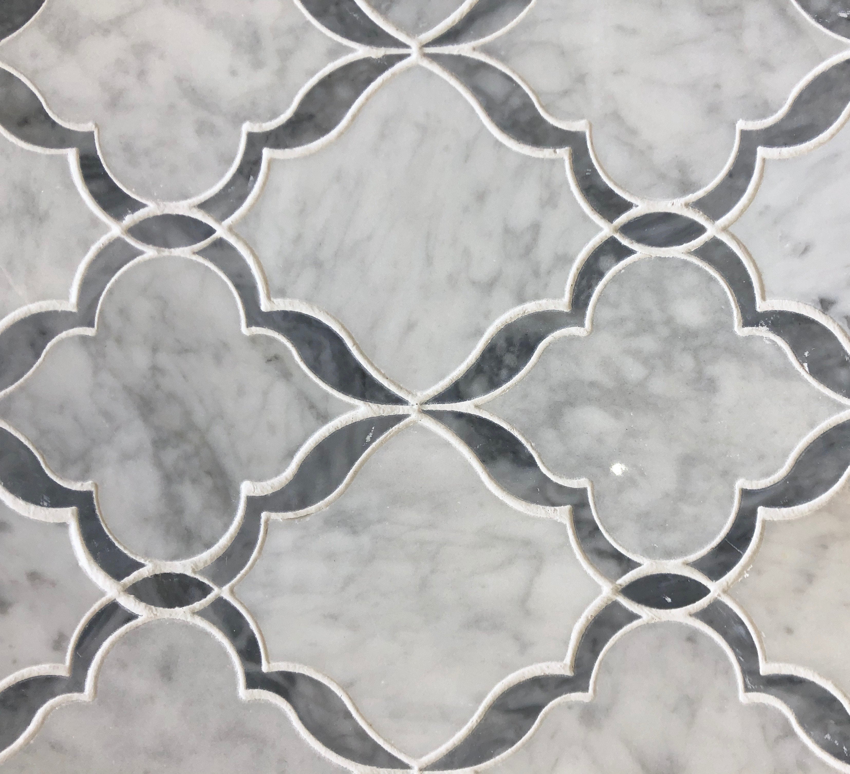 Flat lay of Carrara White and Bardiglio Venetian waterjet mosaic tile in marble finish