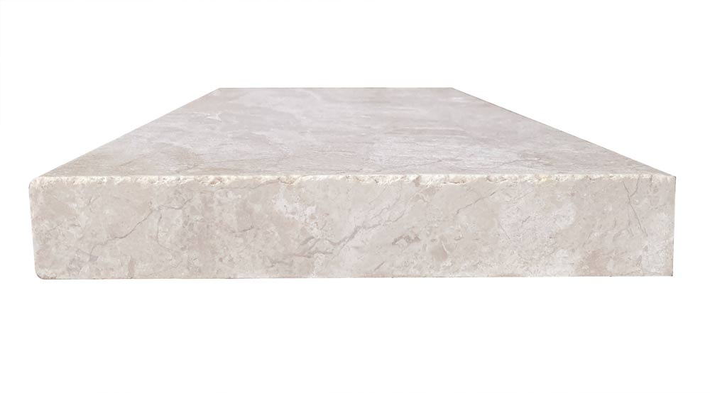 Close-up of Verona Marble showing clean edge and natural veining in beige tones