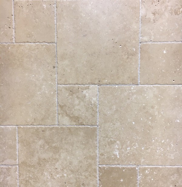 Top view of Warm Walnut Travertine Versailles Pattern tile set with brushed and chiseled finish